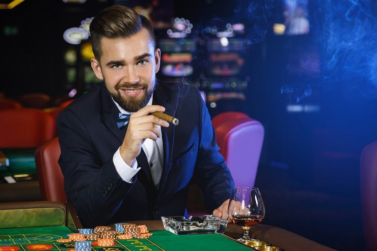 Live studio setup with croupier at baccarat table and multi-angle camera feeds
